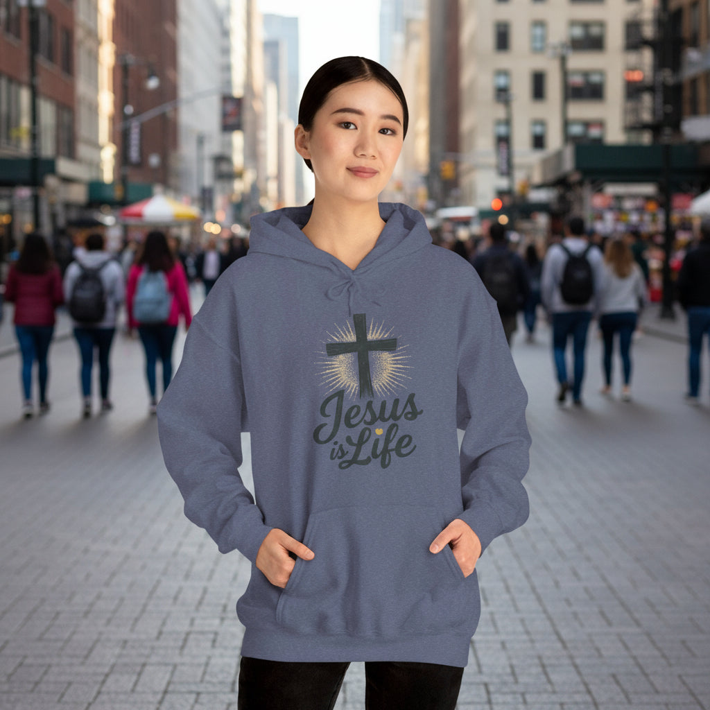 Person wearing a blue hoodie with 'Jesus is Life' text and cross design on a white background

